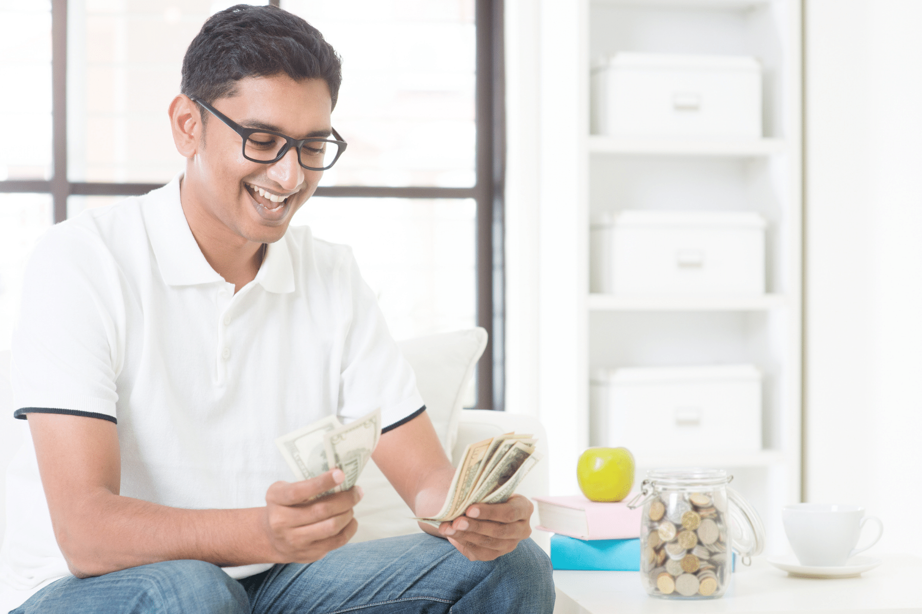 White person counting a stack of one dollar bills